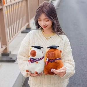 Cute capybara plush toy in graduation gown and cap for students commemorative gift