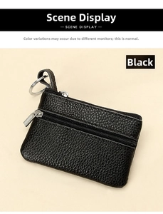 Close-up of black pebble leather coin pouch with silver zipper and metal keychain ring