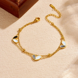 Retro double-layer gold plated stainless steel bracelet with black and white heart charms