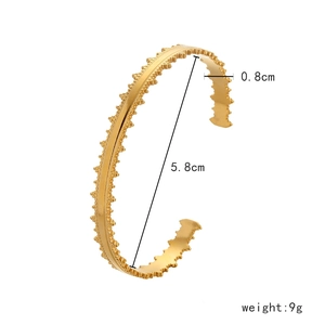 Detail view of gold coin sun bracelet showing 5.8cm diameter and 0.8cm width specs