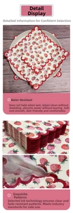 Detail of strawberry print paper napkins with red scalloped edges and floral texture