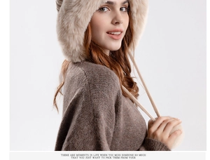 Detail of winter beanie with plush faux fur trim and knit drawstring tassels