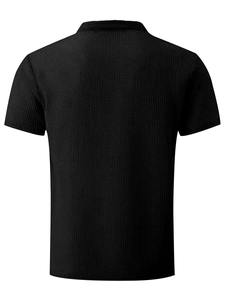 Back view of a black short-sleeved polo shirt showing breathable waffle knit texture