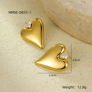 Detail of gold heart earrings with zircon inlay showing 3.4cm width dimensions