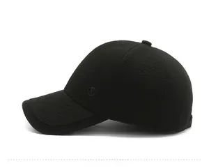 Detail of middle-aged men's winter wool baseball cap showing twill texture and metal logo