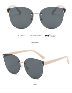 Detailed front and side view of frameless butterfly sunglasses with cream frames and grey lenses