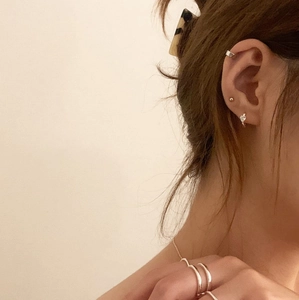 Minimalist S925 sterling silver ear cuffs and rings set displayed on a model