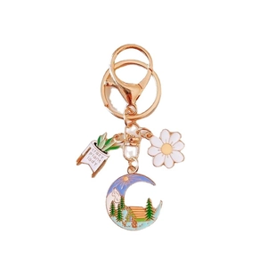 Floral moon keychain with crazy plant lady charm and daisy pendant in gold finish