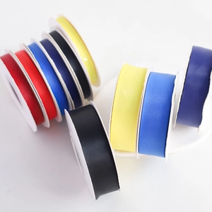 Multiple rolls of solid color matte cotton ribbons for gift wrapping and flower bouquets