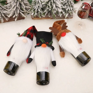 Three Nordic style Christmas wine bottle covers with gnome and reindeer designs