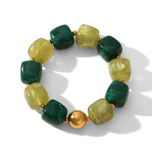 Detail of beaded bracelet with green marble texture squares and polished gold accent ball