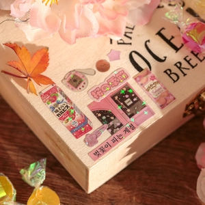 Vintage Japanese laser pink stickers featuring cherry blossoms and houses on a wood box