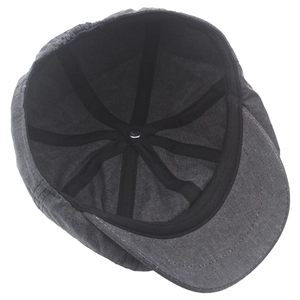 Dark gray washed cotton newsboy cap showing internal structure and elastic back design