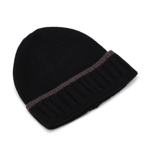 Close-up of black knitted beanie showing fine texture and brown grey striped cuff detail