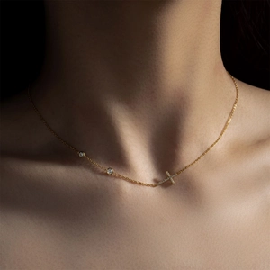 Elegant 18K gold plated S925 silver cross necklace with zircons worn by a model