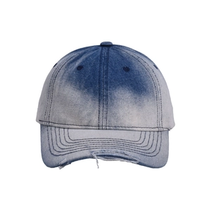 Close-up of distressed brim details on gradient blue tie-dye denim baseball cap