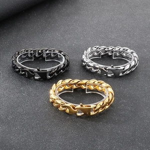 Detail of 18mm Cuban link bracelets in gold, silver, and black with secure clasp
