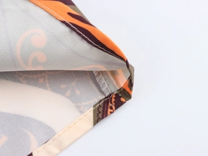 Macro shot of abstract pattern fabric texture and stitching detail on the casual set