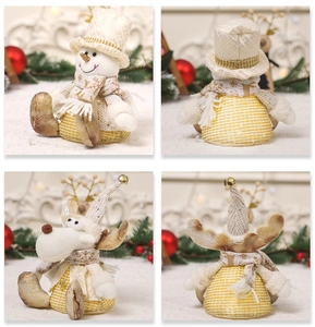 Front and back views of plush Christmas snowman and reindeer ornaments in gold and white
