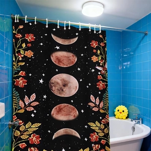 Detail of moon phase shower curtain with red floral patterns hanging in bathroom
