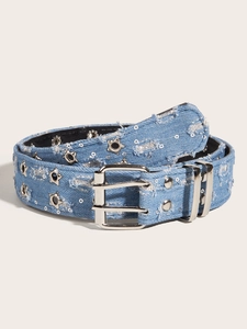 Detail of blue denim belt with silver star studs, sequins and double prong buckle closure