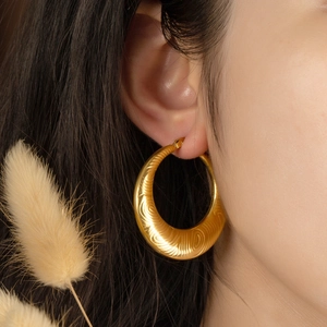Fashionable golden textured hoop earring with irregular patterns for women's jewelry