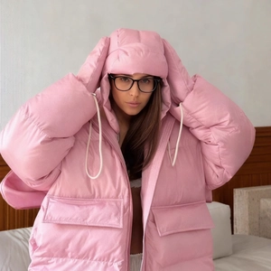 Pink oversized hooded down jacket featuring cute rabbit ears and fluffy padded texture