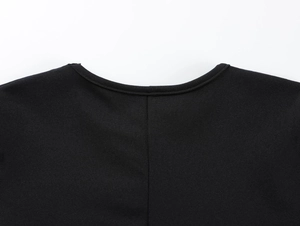 Close-up of black knit T-shirt neckline with premium stitching and texture detail