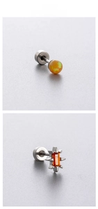 Detail of yellow opal ball and starburst zircon titanium steel stud earrings