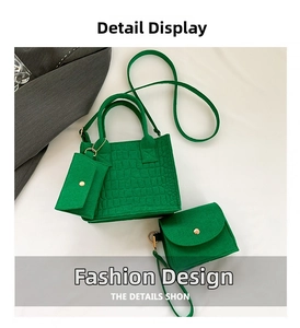 Detailed view of three-piece bright green crocodile texture tote bag with golden hardware
