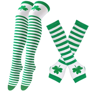 Detail of green and white striped over-knee socks and arm sleeves with shamrock patterns