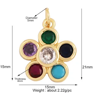 Macro view of gold flower pendant with multi-color gems showing 15mm diameter size detail