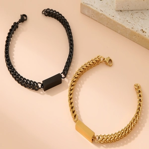 Polished 18K gold and matte black Cuban link bracelets with rectangular ID plates