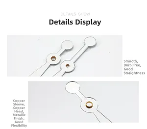 Close-up of smooth silver quartz clock hands with premium brass bushings and metal texture