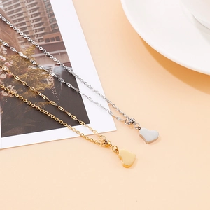 Minimalist heart pendant necklaces in gold and silver finish with polished surface