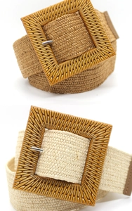 Detail of woven straw-style elastic belts with large square wood-texture buckles in two colors