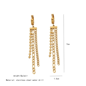 Detail view of 7cm gold stainless steel tassel earrings showing chain length and width