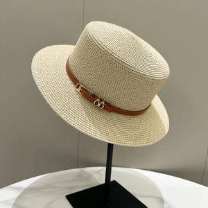 Chic beige straw boater hat with flat top and brown leather band for summer sun protection