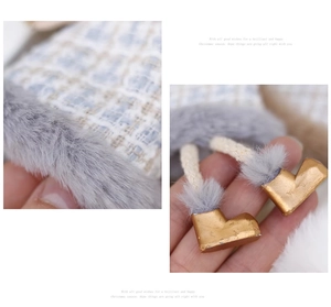 Macro detail of Christmas angel doll featuring tweed fabric and golden boot accents