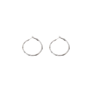 Minimalist twisted geometric silver circle earrings with textured surface on white background
