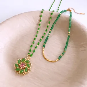 18k gold plated glass beaded flower necklace with emerald green stones and red accents