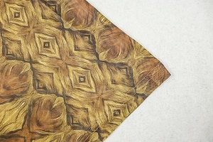 Macro shot of retro geometric print fabric with durable double-needle stitching detail