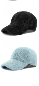 Detail of plush faux fur baseball caps with ribbed texture in black and light blue