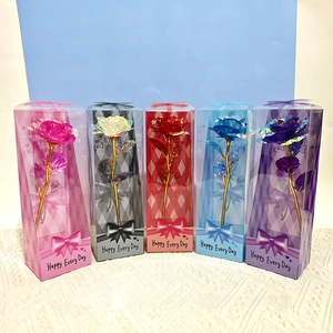 Row of colorful gold foil roses in transparent gift boxes with Happy Every Day text