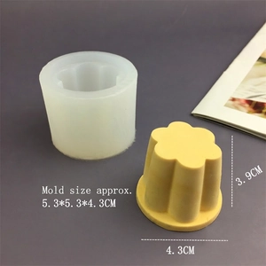 Macro view of transparent silicone flower mold with dimensions and yellow wax model