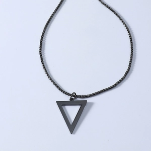 Detail of black plated titanium steel box chain with hollow triangle pendant