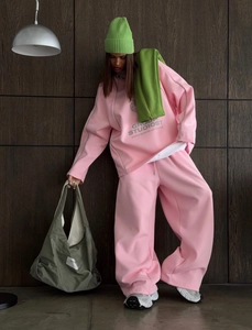 Close-up of pink casual tracksuit with letter print and premium cotton blend fabric