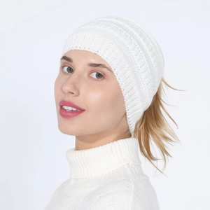 Close-up of white ribbed knit headband with ponytail hole for winter hairstyles