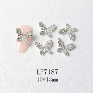 Macro view of 3D silver butterfly nail charms with rhinestones and size dimensions
