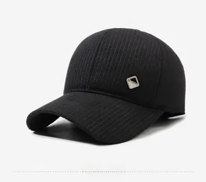 Detailed macro view of black winter baseball cap with side fashion metal emblem